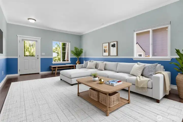 Flexible entry area with front room virtually staged.