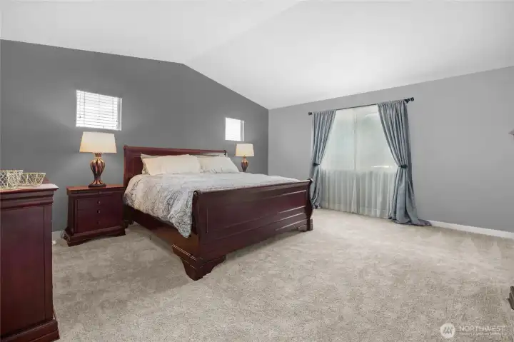 Spacious primary bedroom with ample light.