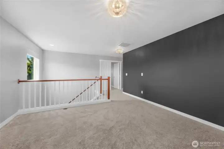 Second floor loft designed to be easily reconfigured as a fourth room.