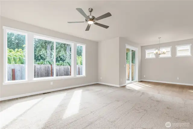 Oversized windows allowing lots of natural light into the open family room featuring 9' ceiling.