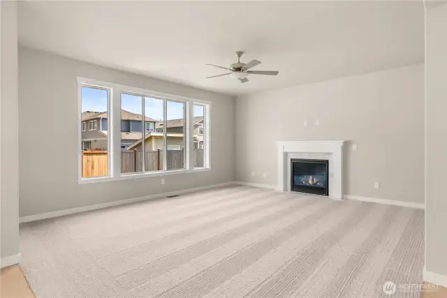 Family room is pre-wired for easy installation of TV and entertainment equipment and features a cozy gas fireplace with tile surround for those cooler evenings. Standard ceiling fan provides light and comfort.