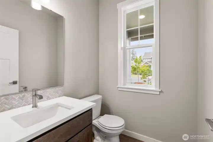 Powder room on main floor is ideal for guests.