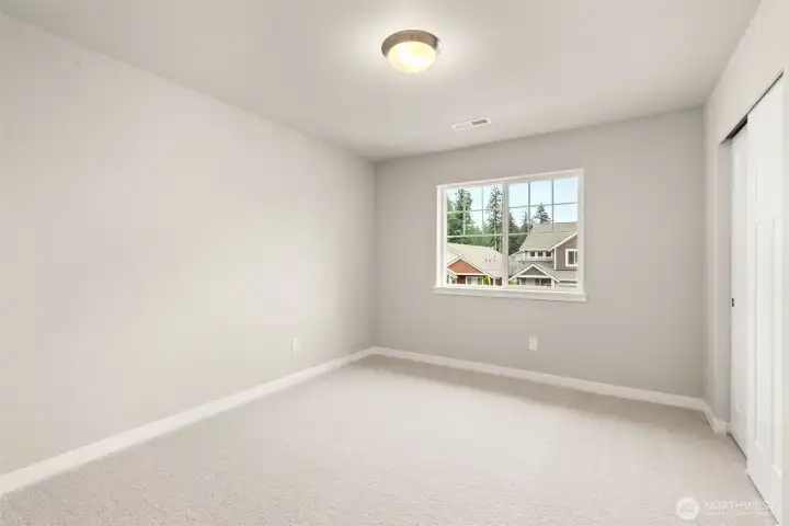 Second bedroom with 8' ceiling with a standard reach-in closet and prewired for internet.