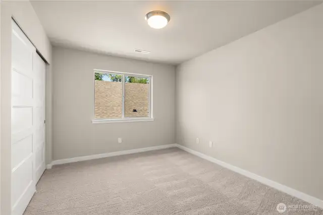 Second bedroom  with 8' ceiling with a standard reach-in closet and prewired for internet.