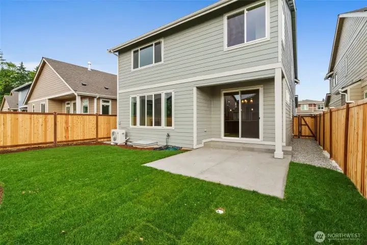 Backyard is landscaped and fully fenced with a patio.