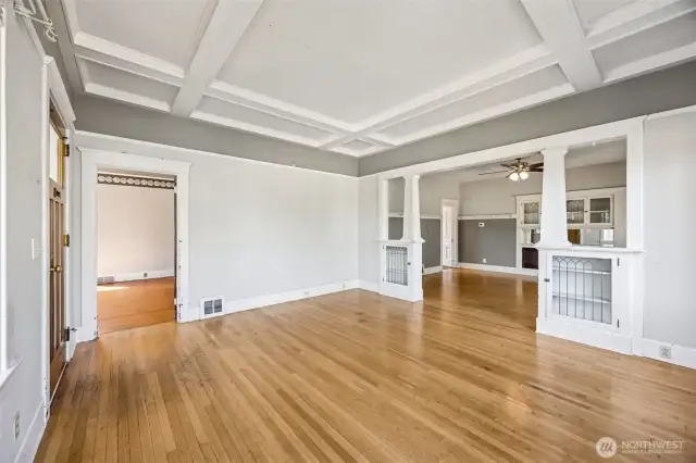 Living Room peeking into the dining room and the 1st of 3 main floor bedrooms