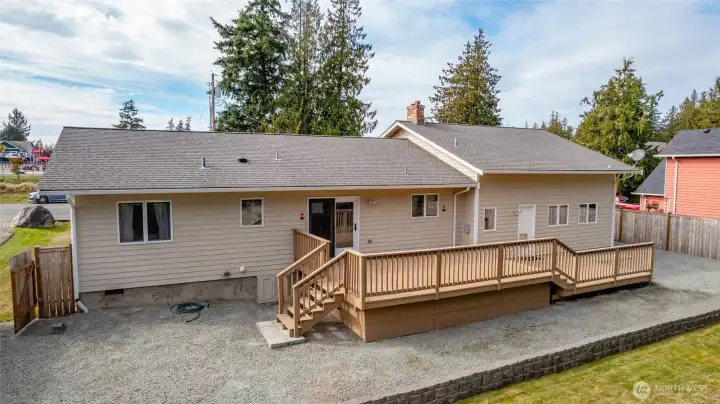Access to deck from dining area & garage.