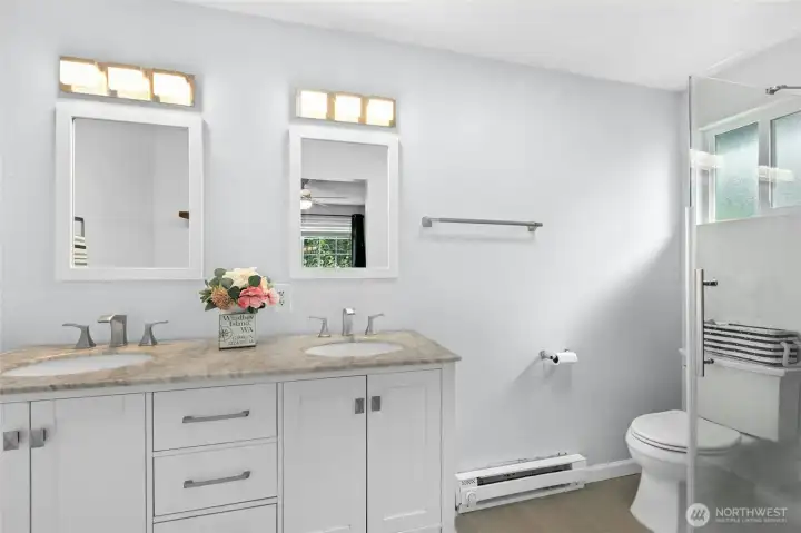 Large Primary Bathroom with Double sinks and walk in shower.