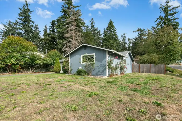 Large spacious corner lot. Surrounded by fragrant rose bushes.