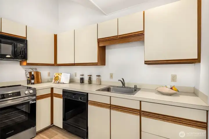 Plenty of countertop space and cabinet storage. Brand new range and laminate flooring!