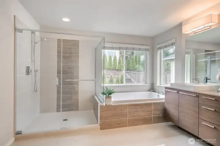 Primary bath shower with tile wall and glass door