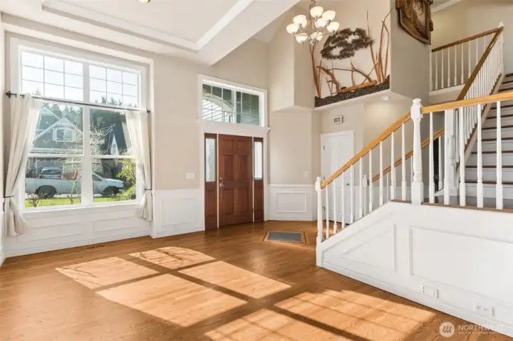 A dramatic 16-foot entry welcomes you with soaring volume and natural light. The moment you step inside, the home feels open, bright, and impressive. It’s an entry designed to make a statement. The newly refinished oak hardwoods are stunning.