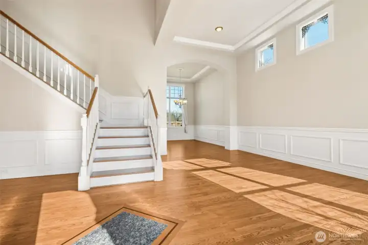 Refinished hardwood floors add warmth and sophistication throughout the main level. Their rich tone enhances the home’s inviting atmosphere. Every step reflects quality craftsmanship.
