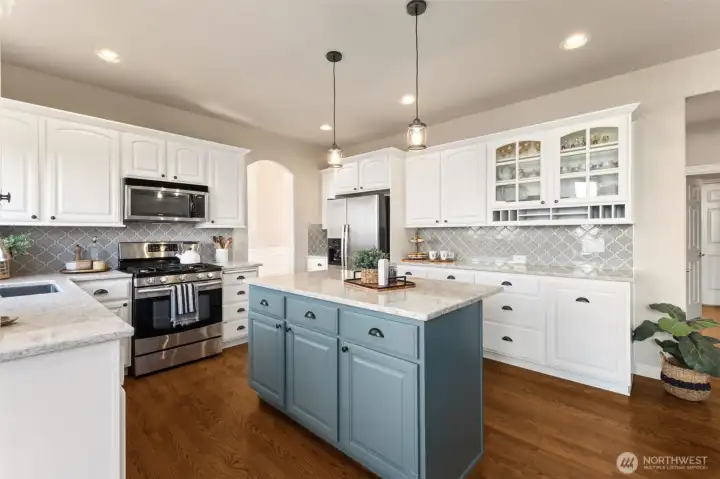 The remodeled kitchen features modern finishes and a fresh, updated look. Clean lines and quality materials elevate the entire space. It’s a kitchen designed to inspire.