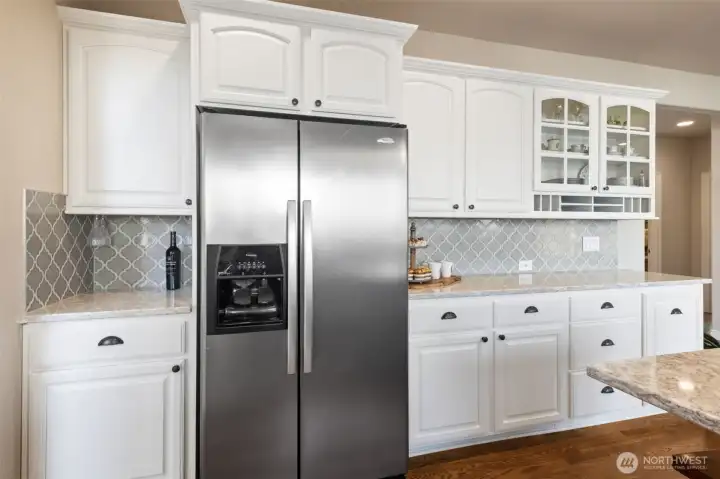 The kitchen layout supports both daily routines and special occasions with generous storage that is attractive, yet practical.