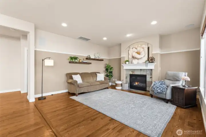 Main floor family room with easy access to the back patio and yard. Huge windows allow for lots of incoming natural light.