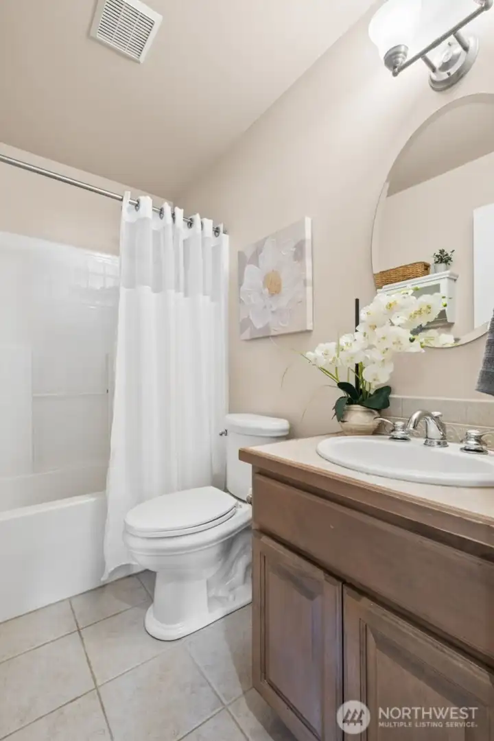 n adjacent full bath on the main level enhances convenience and functionality. Guests enjoy privacy, and the layout supports multi-generational living. It’s a thoughtful design choice that expands how the home can be used.