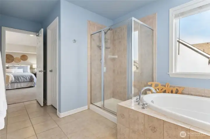 An oversized walk in shower and not one, but two walk in closets are a welcome feature to this already lovely   En Suite.