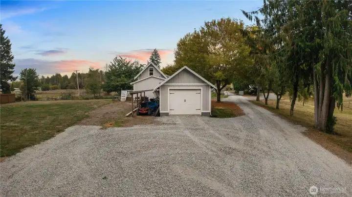 Detached 420 sgft garage with a huge covered space for storage.