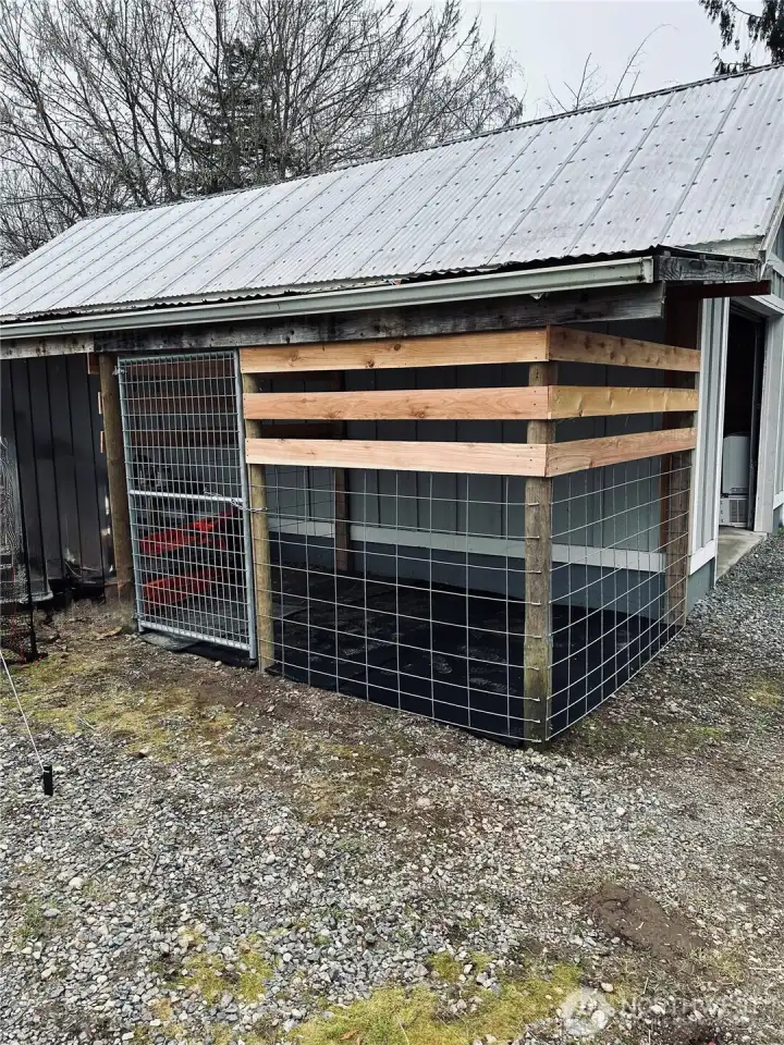 Enclosed dog kennel.