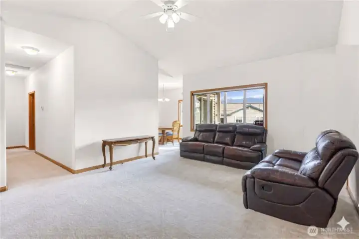 Spacious Living Room with Vaulted Ceilings and Natural Light in sunny Sumas - Virtually Decluttered