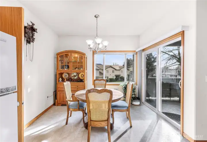 Dining Area with Large Windows and Access to Covered Patio