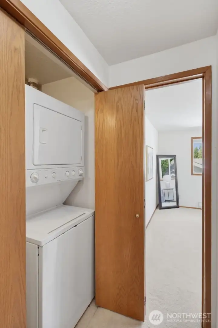 hall stacked laundry with sink