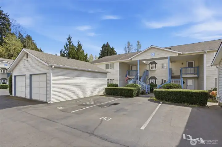 Garage and designated parking spot both with condo