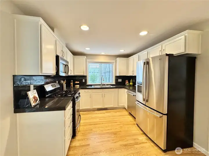 Chef's Kitchen w/ stainless steel appliances, new dishwasher + custom cabinetry w/ soft closing drawers. Chef's Kitchen w/ stainless steel appliances, new dishwasher + custom cabinetry w/ soft closing drawers.