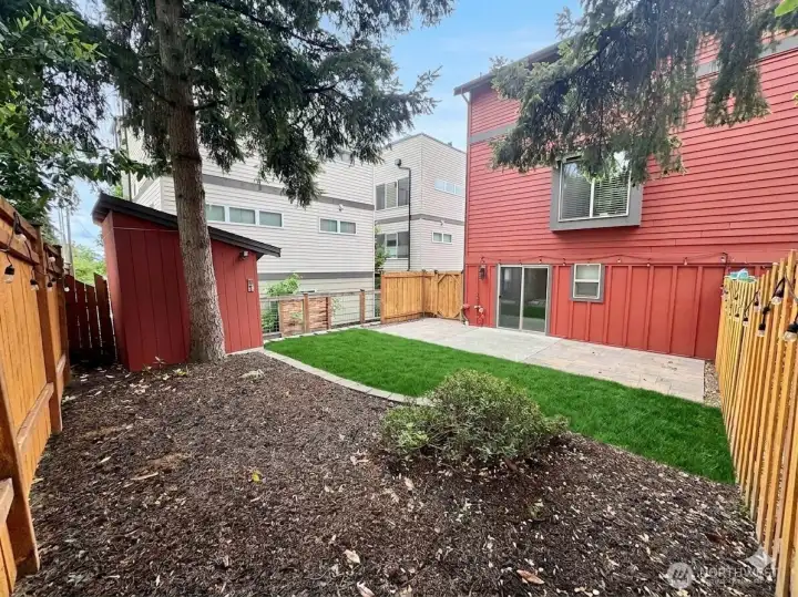 Raised garden beds in backyard + workshop w/ heat & electric. Raised garden beds in backyard + workshop w/ heat & electric.
