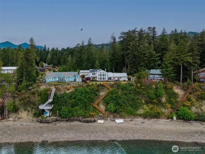 The home with the solar panels and swim platforms.