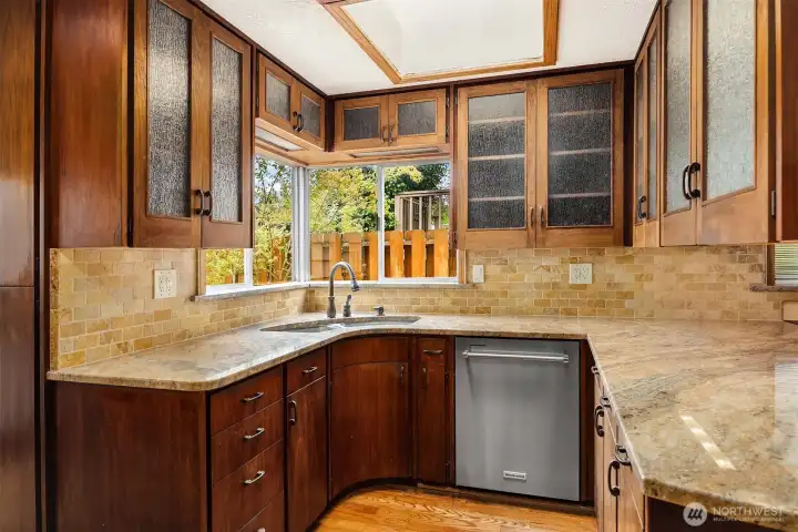 Spacious kitchen with ample countertops and storage. Spacious kitchen with ample countertops and storage.