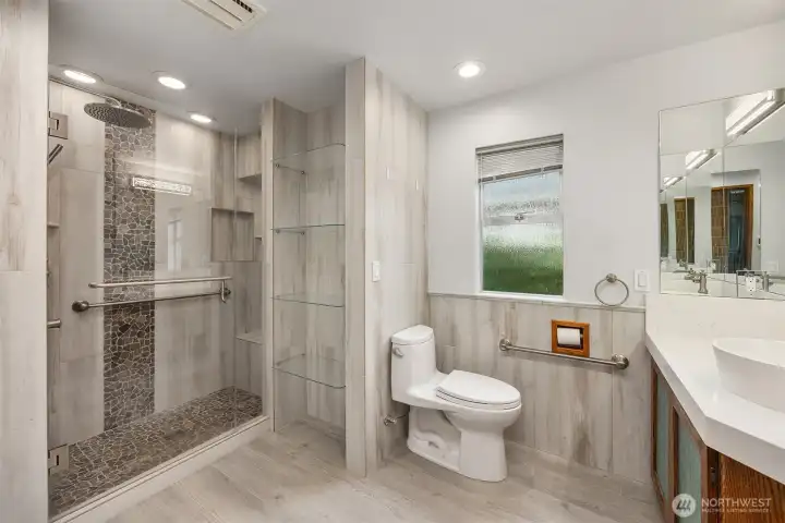 Main level bathroom with heated floors. Main level bathroom with heated floors.