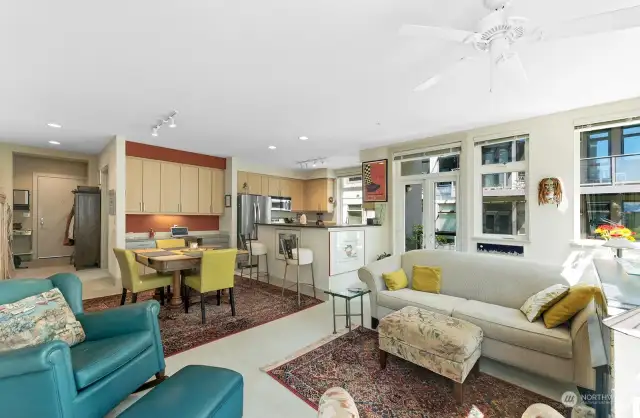 First time on the Market since New!   This SE corner Home is filled with natural Light from Walls of Windows.  From the Living Room, there is even a View of Downtown Seattle and Gasworks Park.