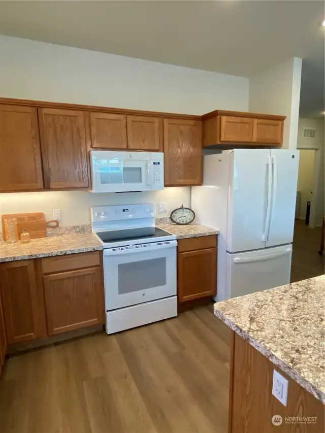 Upgraded refrigerator has french doors and bottom freezer; ice and water.