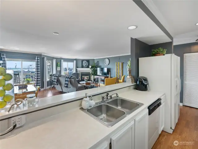 Love that open feel!! This kitchen is fully equipped with all the bells and whistles. It even offers a large floor to ceiling pantry.