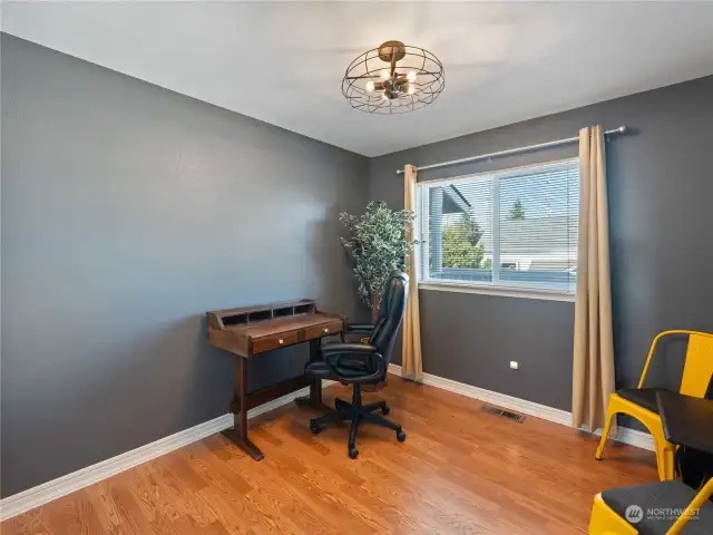 This is the second bedroom which could also be utilized as an office. It offers fresh paint and trim, updated lighting and ample closet space.