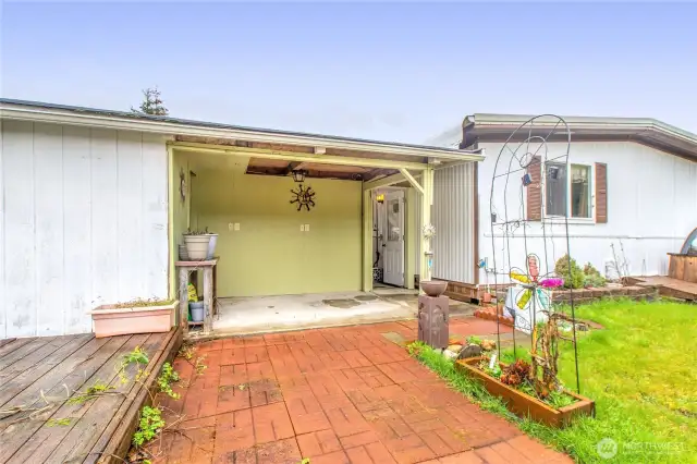Backyard has a nice covered patio and a deck to relax on to while you watch the wildlife play.