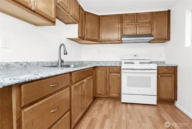 Nice update kitchen with laminate flooring.