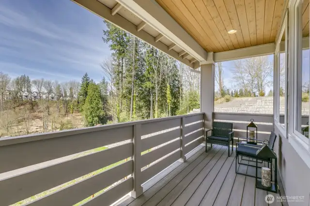 Covered deck off main with Sunset view. Photo is of the staged model, the same 2,958 sf floor plan as the listed home.  Colors vary.