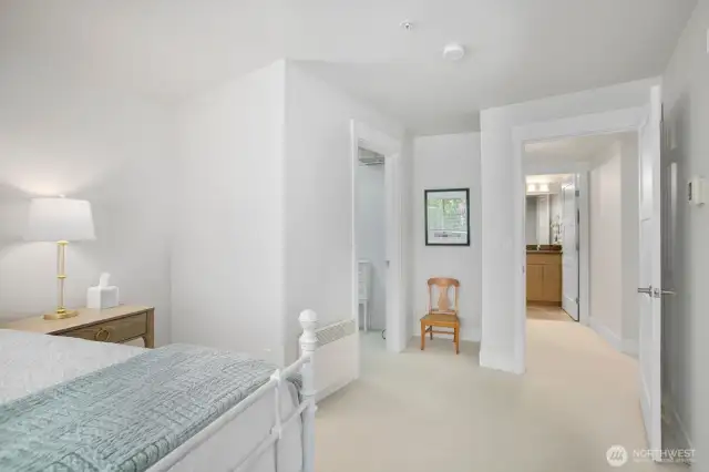 Huge walk-in closet (door to the left), tons of shelving and space for hanging clothes. Main bath straight ahead.