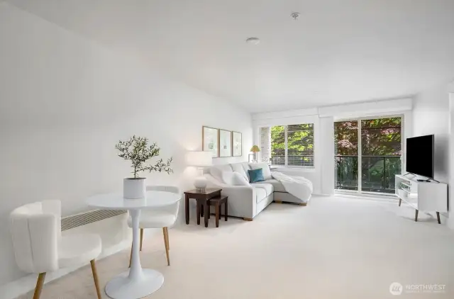 The great room with adjacent kitchen has lots of room to entertain guests.