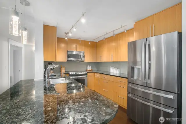 Brand NEW GE Profile fridge, large breakfast bar, lots of cabinet storage. Notice the fancy new pendant lighting!