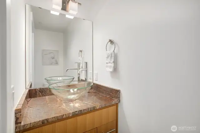 Elegant powder Room/half-bath with gorgeous glass bowl sink.