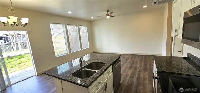 Looking into main living area. Lots of windows