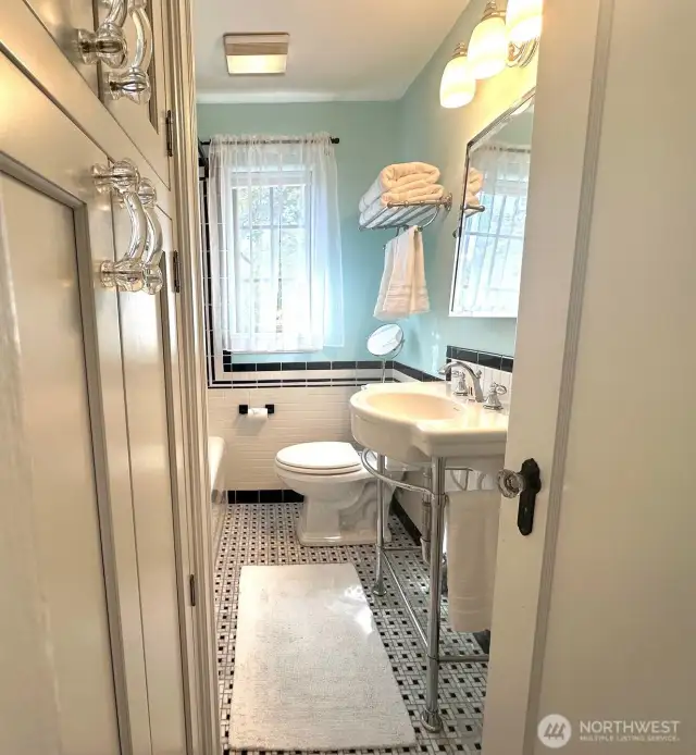 Full bathroom off the second floor hallway.  You can't see it in the photo, but there's a huge soaking tub and a large storage cabinet.