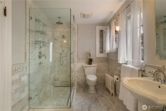 Elegant glass shower and leaded glass medicine cabinet