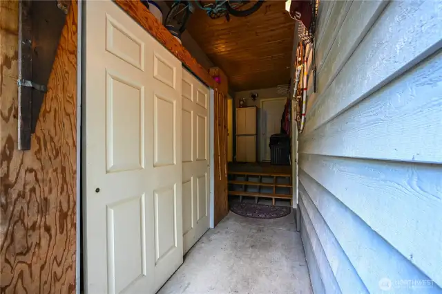 This breezeway between the house and garage has extra storage AND a half bath!  Perfect to clean up before coming in the house.