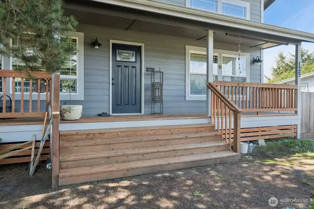 Beautifully oversized stairs lead to the massive covered front porch. Grand Entrance!