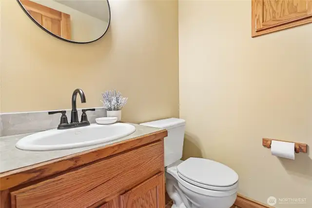 Freshly updated main floor half bath with stylish new fixtures.